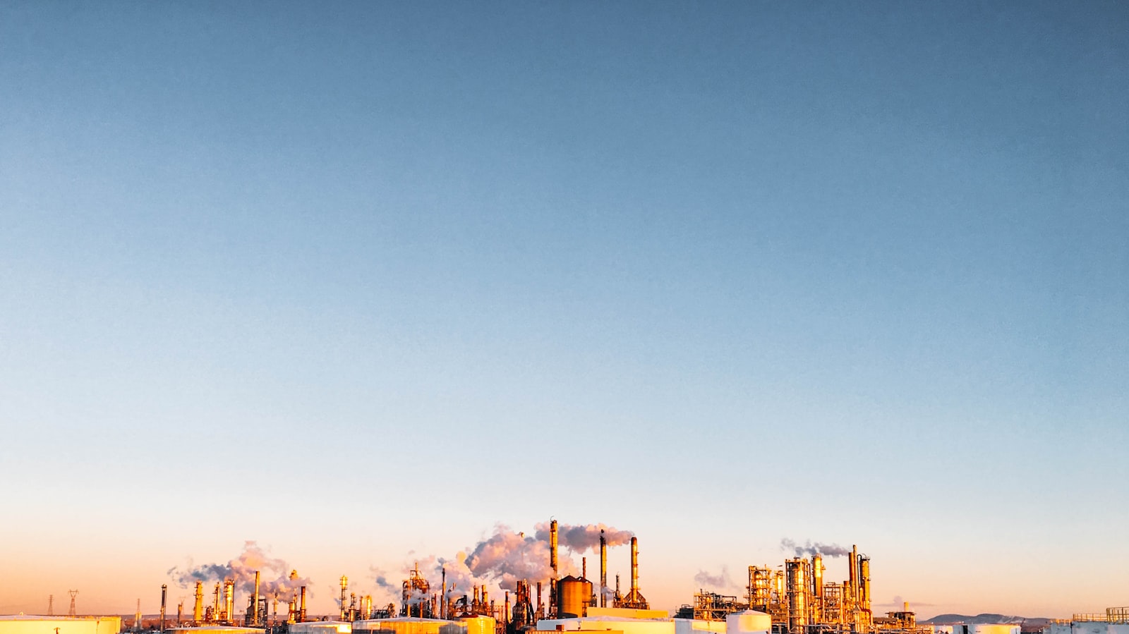 Energy and process-industry plant at dusk — a sector Maseer Talent recruits for across the UAE